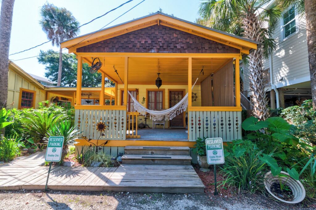 Cottage with a covered front porch at Beachside Boutique Inn