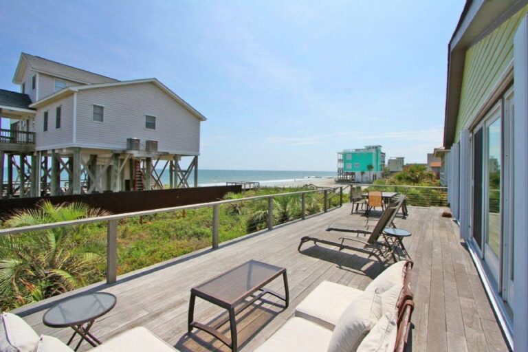 Oceanfront deck with lounge chairs overlooking the beach