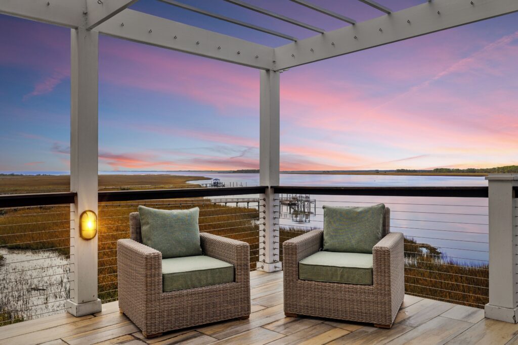 Covered porch overlooking the river at sunset, Regatta Inn