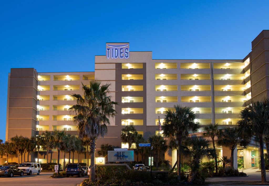 Tides Folly Beach oceanfront hotel exterior at dusk