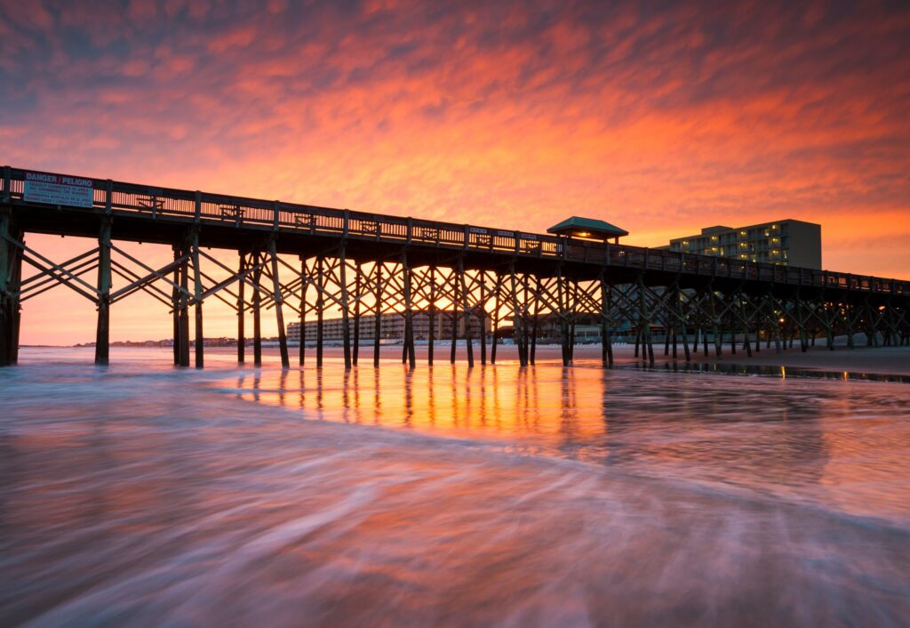 Folly Beach Pier at sunset, next to Tides Folly Beach