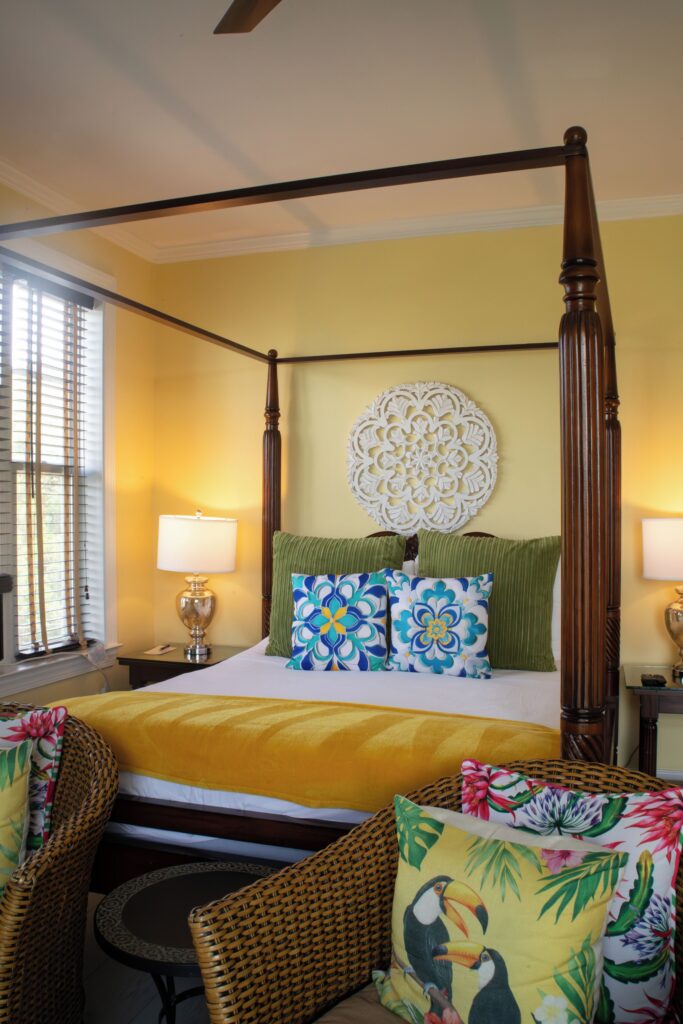 Four-poster bed in a guest room at Water’s Edge Inn
